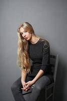 teenage girl slouching on chair photo