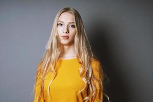 cool young woman with long blond hair photo