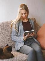 stay at home teenage girl reading e-book photo