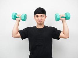 Man gesture pull dumbbell for exercise portrait photo