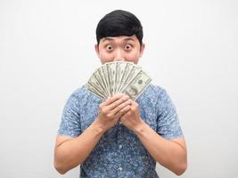 Man excited emotion hold a lot of money close his face photo