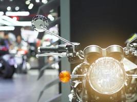 Front light of motorcycle with light flare in motor show event photo