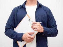 Man holding document board and pen in his hand crop shot photo