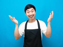 Man wearing apron showing hand up smile face photo