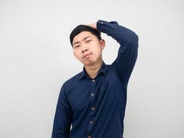 Asian man gesture confident looking and touch his head white background photo