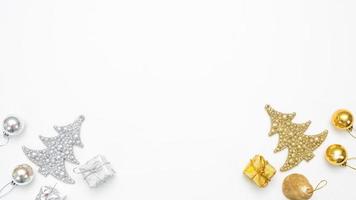 Golden and silver christmas items on white background top view copy space photo