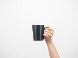 Close up man hand holding coffee cup white isolated photo