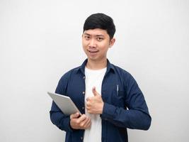 Asian man holding tablet and thumb up confident emotion photo
