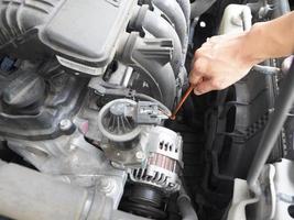 Car maintenance technician checking with car auto engine concept photo