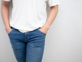 Man white shirt and hand in jean pocket portrait crop shot photo