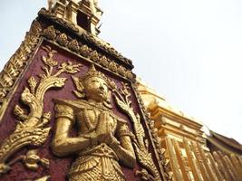 Artist at wall of temple beautiful gold pagoda in Thailand Chiangmai February 2019,Culture of Thailand people photo