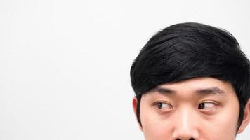 Close up face asian man head shot looking at space white background copy space photo