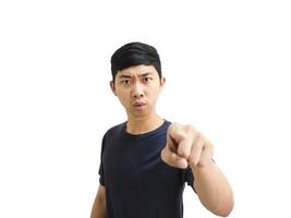 Young Asian man black shirt point right finger at you serious at face and looking camera white isolated background concept photo