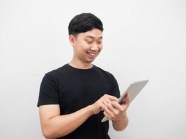 Man smile using tablet gesture checking stock photo