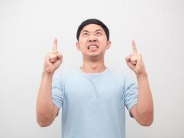 Man blue shirt feeling angry emotion point finger up white background photo