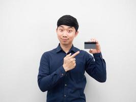 Man point finger at credit card in his hand photo