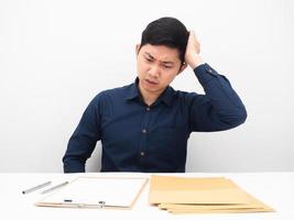 Man feeling headache about many document envolope on table white background photo