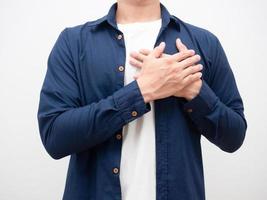 Close up man join hands touch his heart for thankful crop shot photo