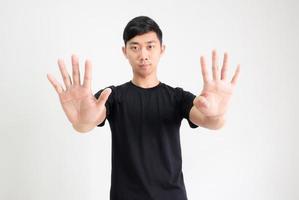 Young Asian man black shirt count one to ten by hand half body on white isolated background,Man counting number concept photo