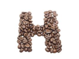 semilla de café palabra 'h' en blanco aislado foto