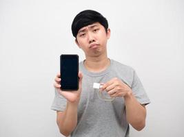 Man holding mobile phone and charging mobile bored emotion photo