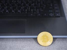 Bitcoin with keyboard of laptop the digital money photo