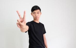 Young Asian man black shirt count one to ten by hand half body on white isolated background,Man counting number concept photo