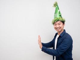 Man with happy new year hat gesture push hand copy space photo