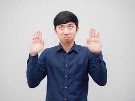 Man feeling bored looking up and show hands up on white background photo