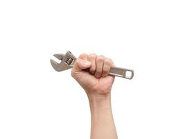Hand holding adjustable wrench on white isolated background,Labor tool technician photo