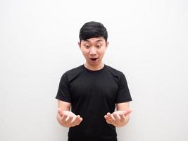 Asian man look at two hand up feel excited and wow face on white background isolated photo