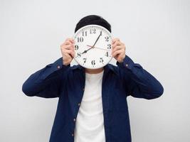 Man close his face by analog clock portrait white background photo