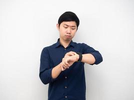 Businessman serious emotion looking at his watch photo