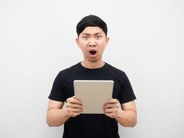 Man holding tablet shocked emotion white background photo