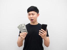 Man feeling happy and excited looking money in hand photo
