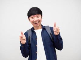 Cheerful man with school backpack point finger at you happy face portrait photo