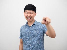 Handsome man blue shirt happy smile gesture point finger at you photo