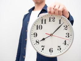 Man show analog clock in hand crop shot late concept photo