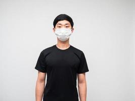 Portrait asian man wearing mask on white background photo