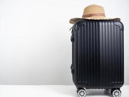 Luggage with vintage hat on the table holiday concept copy space photo