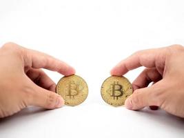 Hand catch gold bitcoin white isolated photo