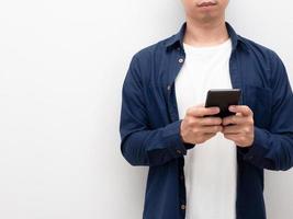 Man using mobile phone in his hand crop body with copy space white background photo