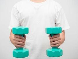 Man holding dumbbell green clolor white background crop shot photo