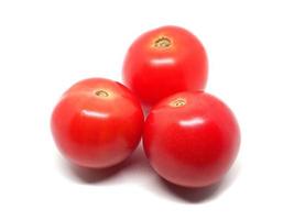 Three fresh plum tomato nature shadow on white isolated