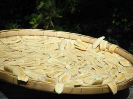 dried banana in basket with tree background,banana in basket photo