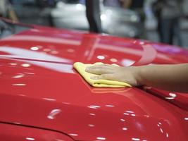 Hand wipe the car shiny clean the new car concept,Hand clean new car