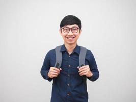 Portrait asian man wearing glasses with backpack business style happy smile on white background photo