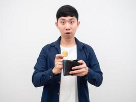 Asian man pick up bitcoin from his wallet feeling amazed at face on white background digital money concept photo