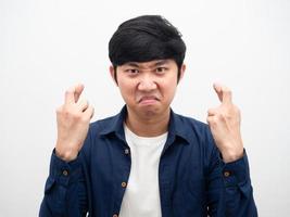 Man angry face corss finger portrait white background head shot,Asian man not satisfied photo