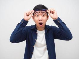 Man take off his glasses for looking and feeling shocked emotion white background photo